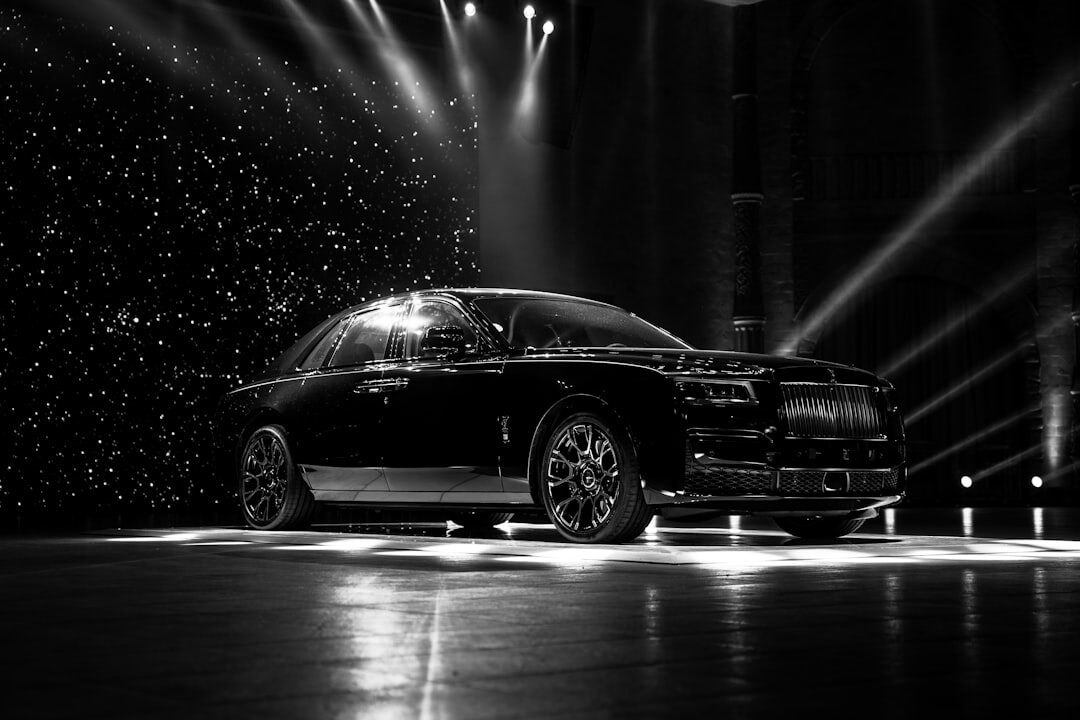 Modern hypercar showcase event with dramatic stage lighting