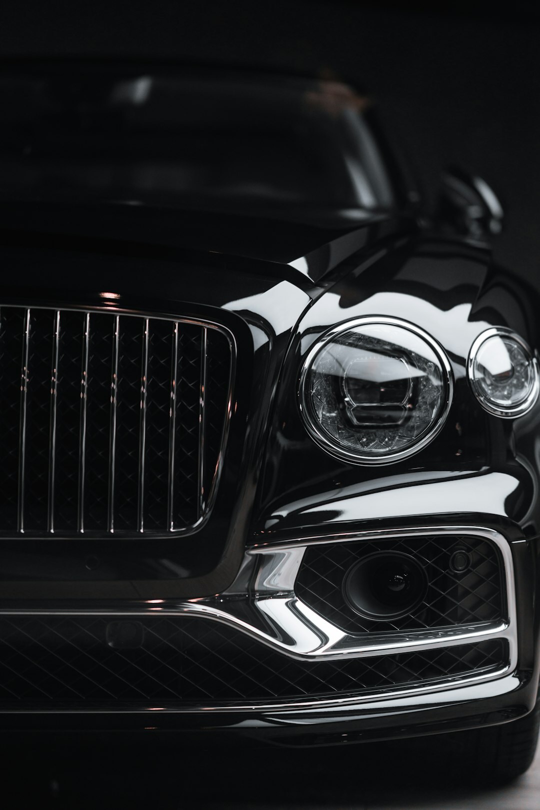 Elegant 1930s luxury automobile photographed in a studio setting