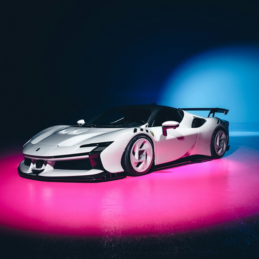 Futuristic electric performance hypercar photographed in a studio setting
