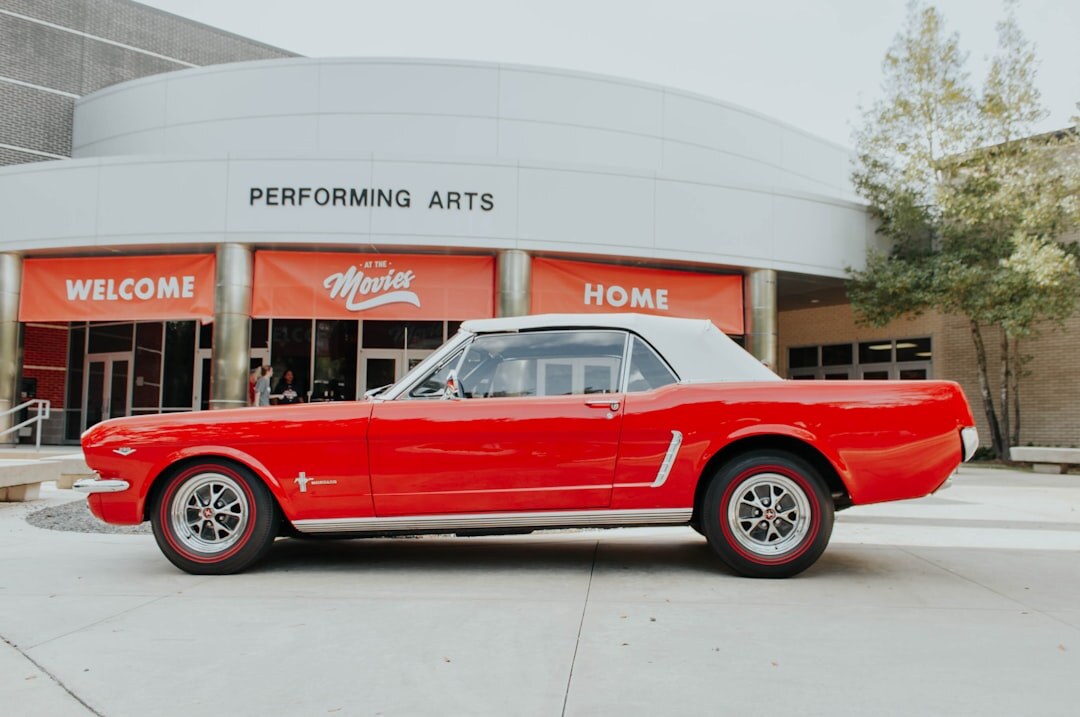Bold 1970s performance automobile photographed in a studio setting