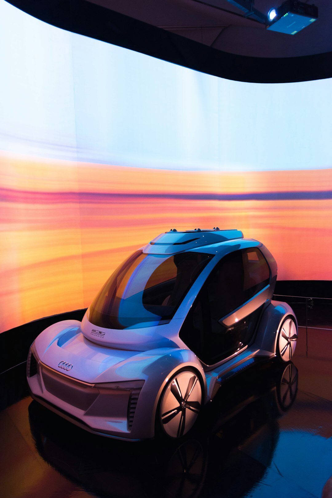 Futuristic virtual museum interior displaying a legendary automobile with holographic interfaces