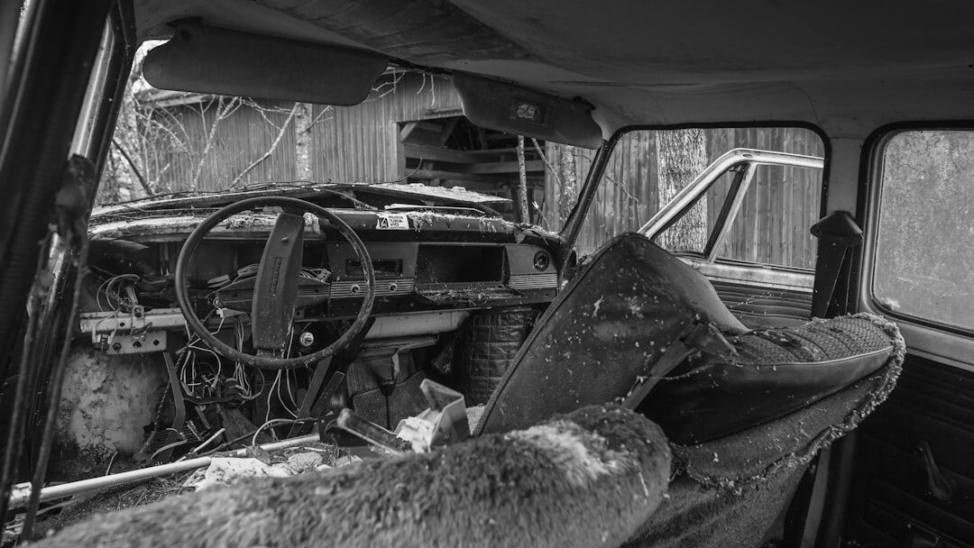 Dusty abandoned vintage automobile found inside an old barn